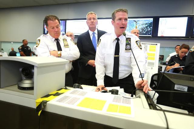Mayor Bill de Blasio was briefed by NYPD Deputy Chief Ed Mullane, left, and NYPD Lieutenant John Mahon, right, regarding security preparation.
